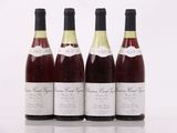 three bottles of wine sit next to each other on a table