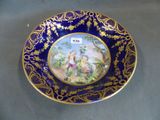 a plate with a picture of a man and a woman on it