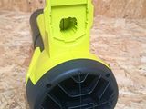 yellow and black blower sitting on top of a wooden floor next to a computer mouse