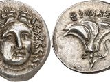 a silver coin with an image of a man ' s face on it