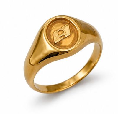 a close up of a gold ring with a letter on it
