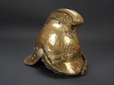 an antique brass helmet with a large face and a large hat on top of it