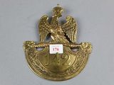 an image of a gold plate with an eagle on it