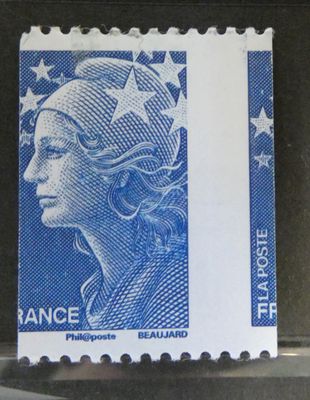 a close up of a stamp with a woman ' s face on it