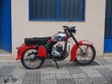 a red motorcycle parked on the side of the street