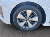 a close up of a tire on a white car
