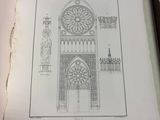une photo représentant un dessin d'un bâtiment posé sur une table