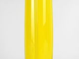 yellow glass vase with feet on a white background