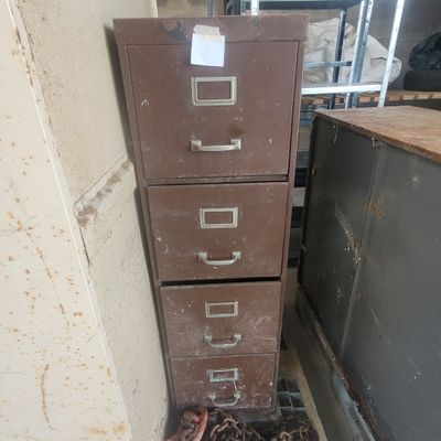 a lot of drawers that have chains on them