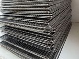 a stack of trays that are on a counter
