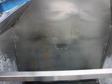 a large stainless steel tank with a metal handle