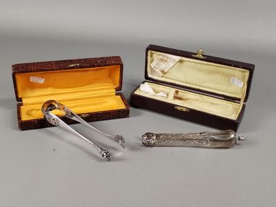 two silverware items are sitting in a case on a table