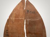 a close up of two pieces of wood with writing on them