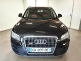the front view of a black audi parked in a garage