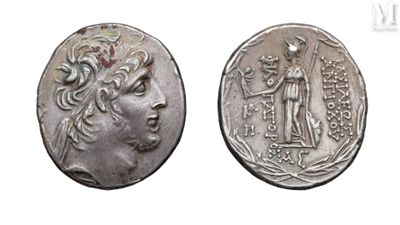 a silver coin with an image of a woman and a man on it