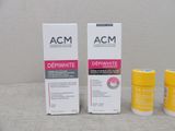 two bottles of acm deriwhite and a tube of deriwhite