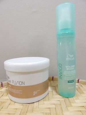 a bottle of lotion and a container of lotion sitting on a table