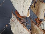 a model of a sailing ship on display on a table