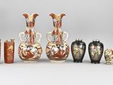 five vases that are sitting next to each other on a table