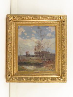 peinture sur le mur d'une pièce représentant une rivière et des arbres