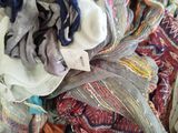a pile of clothes that is sitting in a box