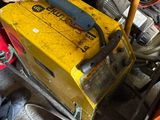 a man that is working on a machine in the garage