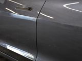 a close up of a car ' s door handle and door handle