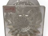 a clear glass plate with a flower design on it