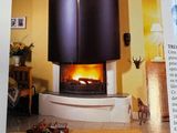 an open book with a picture of a fireplace in it