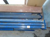 a stack of blue steel beams in a room
