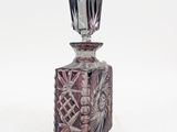 a glass bottle that has a design on it