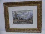 framed picture of a painting of a mountain scene in a gold frame on a white wall
