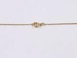 a close up of a gold chain on a white background
