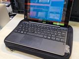 a laptop computer sitting on top of a table