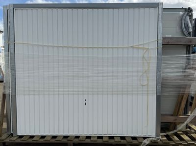 a white refrigerator sitting on a pallet in the middle of a yard