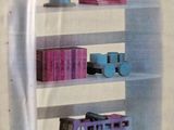 a picture of a book shelf with a toy train on it