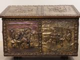a metal box with a painting on it on the floor