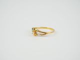 an image of a gold ring with a single stone