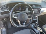 the interior of a car with a steering wheel and dashboard controls