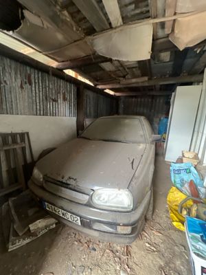 a dirty car that is parked in a garage