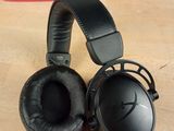 a pair of headphones sitting on a table next to a box