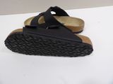 black birketts sandals on a white surface with a white background