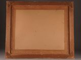 an old picture frame with a picture of a man in a hat