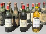 several bottles of wine are lined up in a row on a table