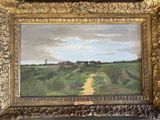 une photo d'un tableau représentant un chemin de terre