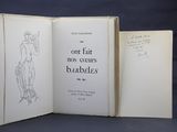an open book with a drawing of a woman on it