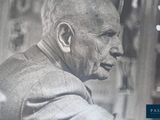 a black and white photo of a man in a suit