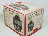 a box with a robot inside of it on a white surface