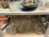 a shelf with a lot of glass items on it