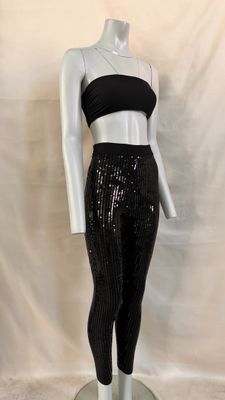the mannequin is wearing a black top and black leggings